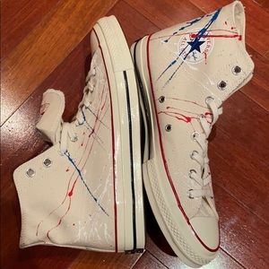 Unisex hi-top Converse paint splattered sneakers